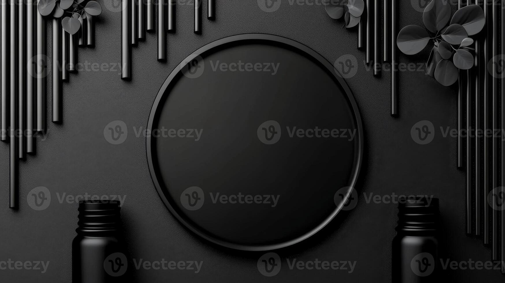 Black plate on dark textured background with cylindrical rods and bottles photo