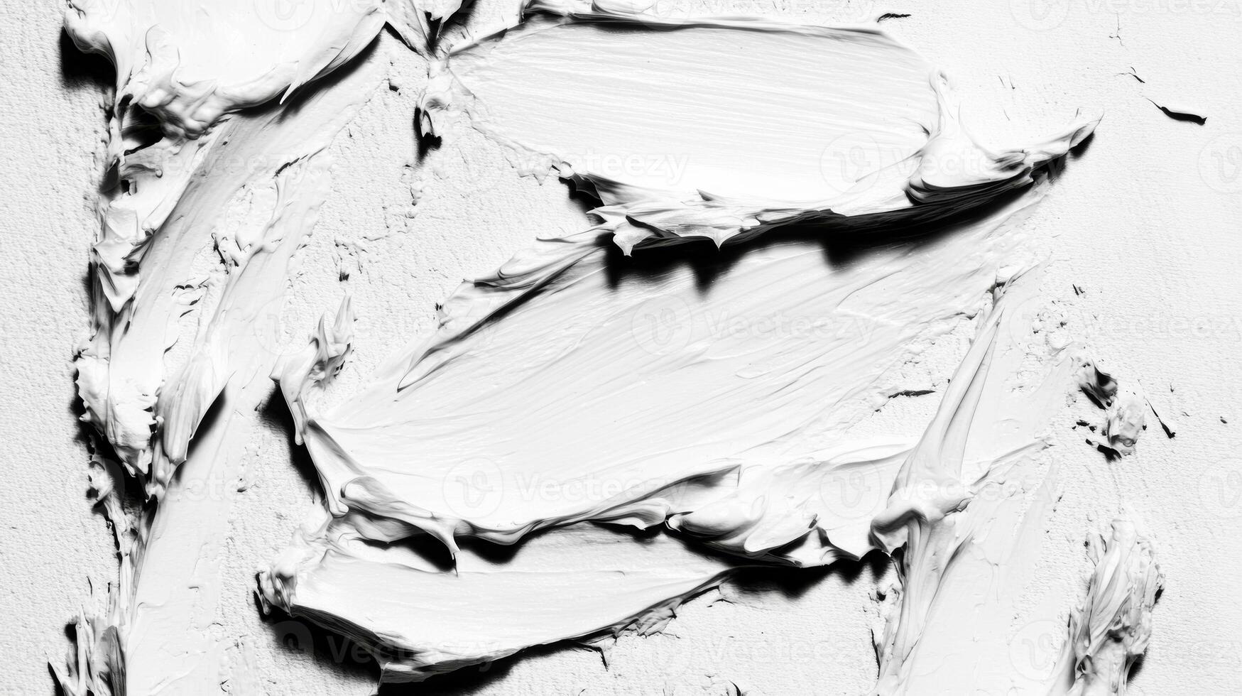 Close Up Monochrome Image of Thick White Paint on Rough Surface photo