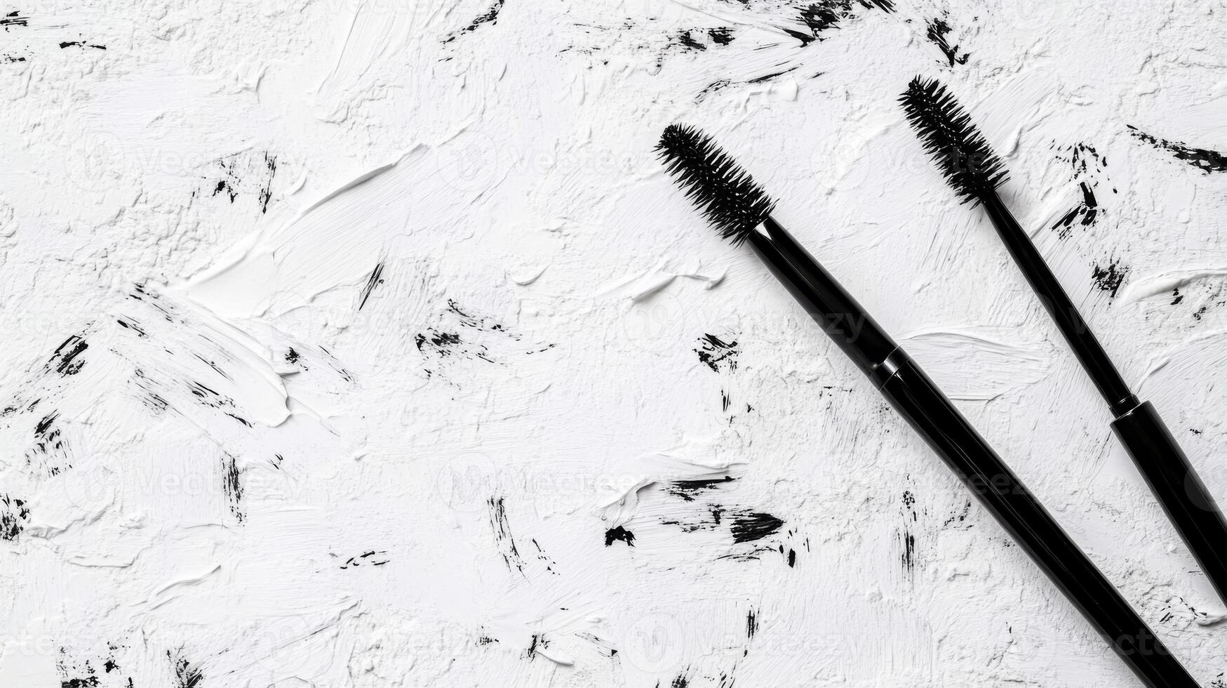 Twin Mascara Wands Resting on Abstract White Surface photo