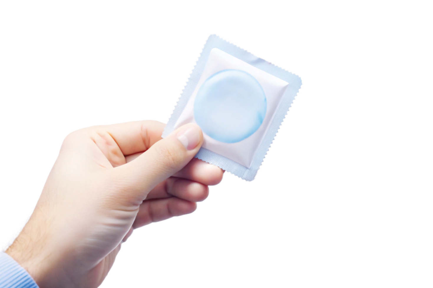 A hand holding a single condom in its foil package against a black background png