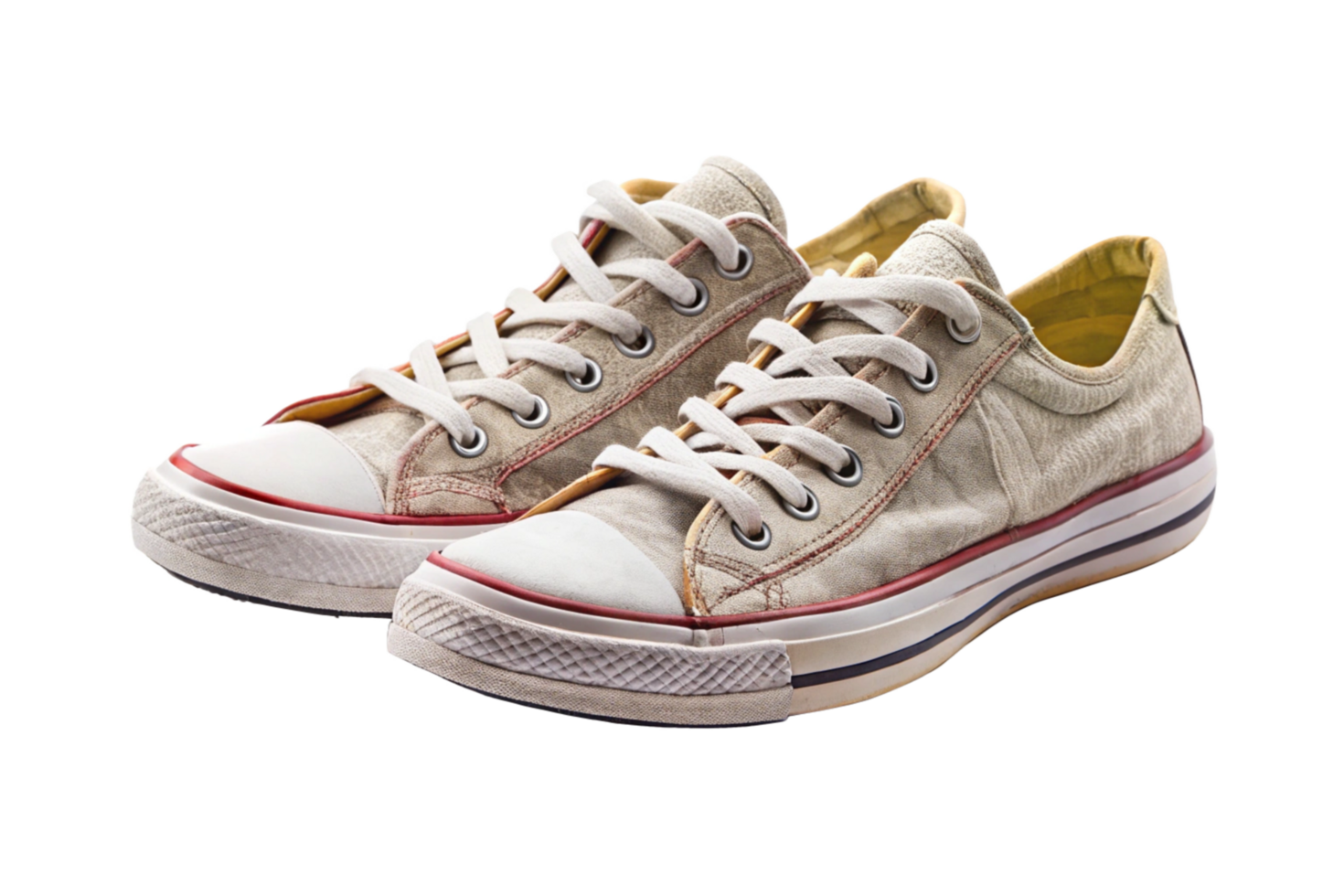 A Pair of WornOut Beige Canvas Sneakers with White Rubber Soles and Red Stitching png
