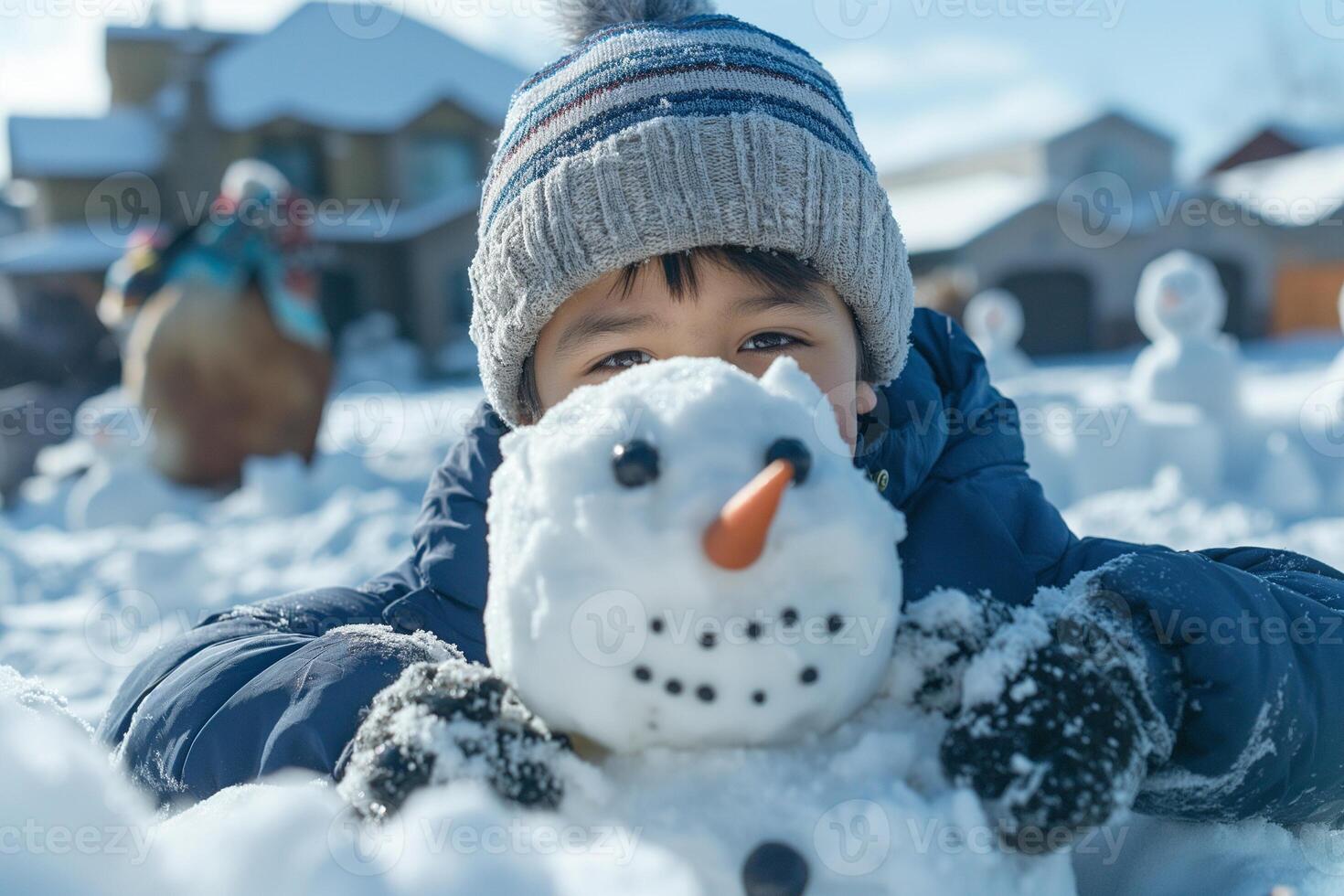 A young boy of Asian descent is joyfully building a snowman in a winter wonderland, showcasing creativity and playfulness. photo