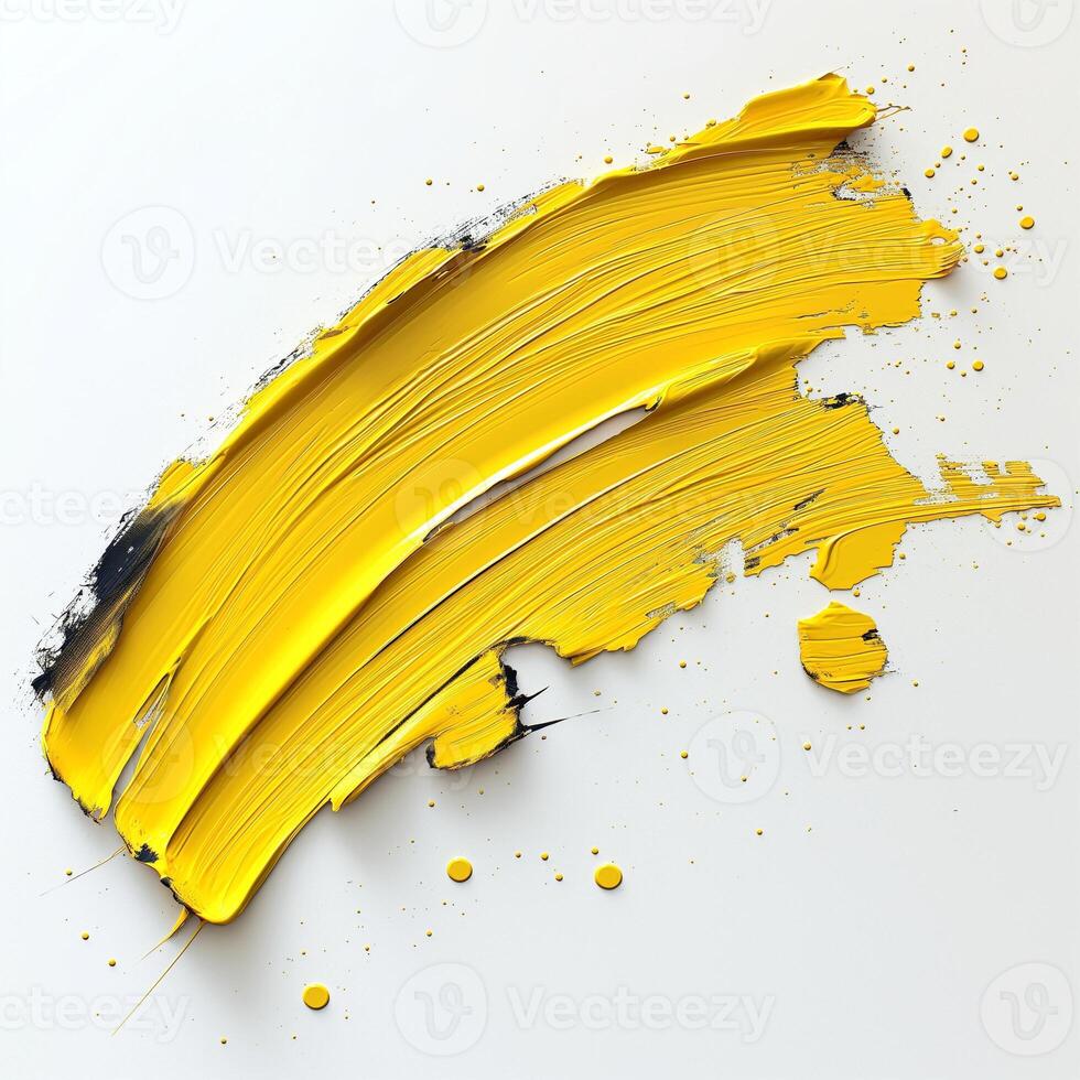 A vibrant brush stroke of bright yellow paint contrasts against a clean white background, showcasing artistic creativity. photo