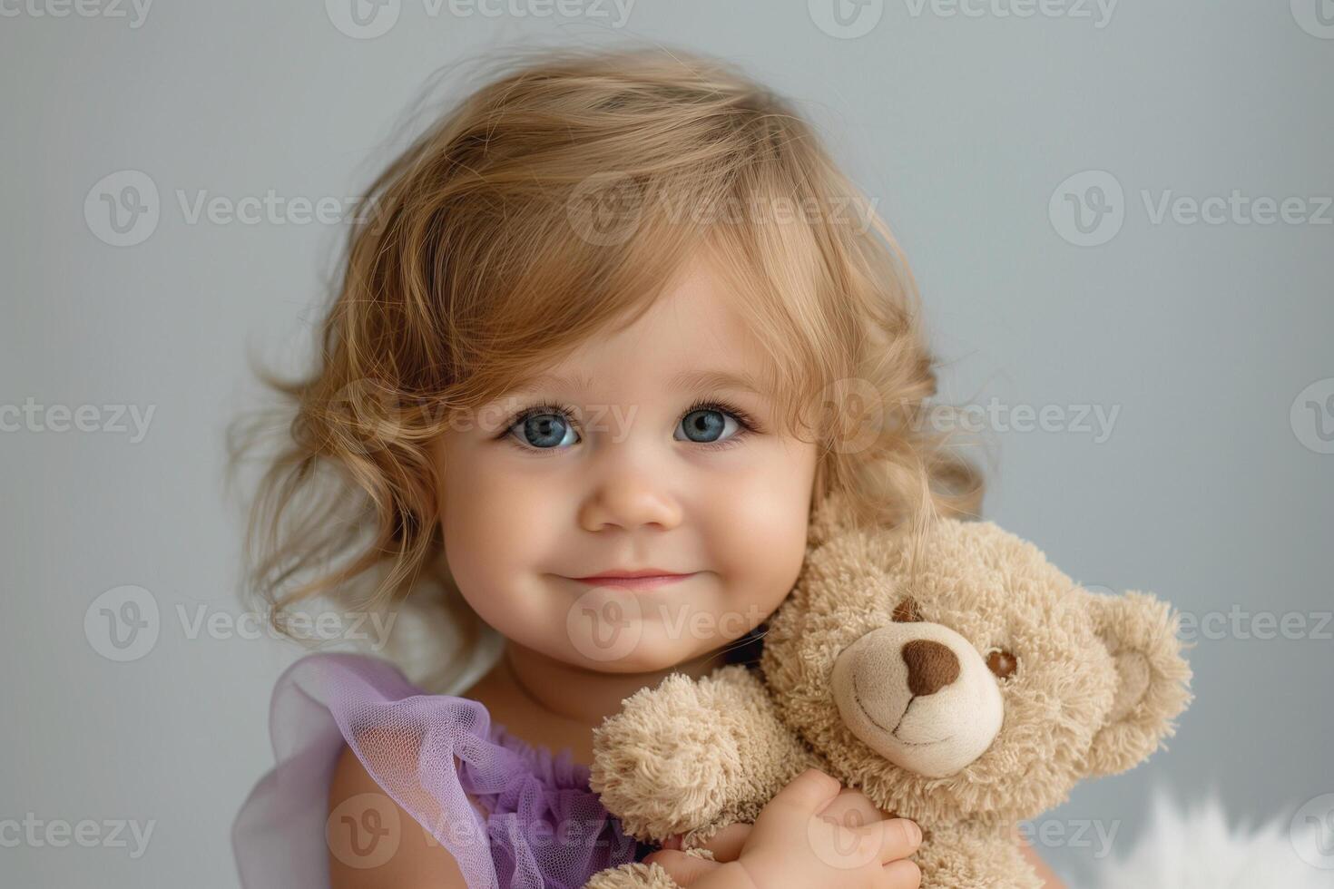 Adorable young girl with wavy blonde hair holding a soft teddy bear, smiling warmly in a pastel-themed setting. photo