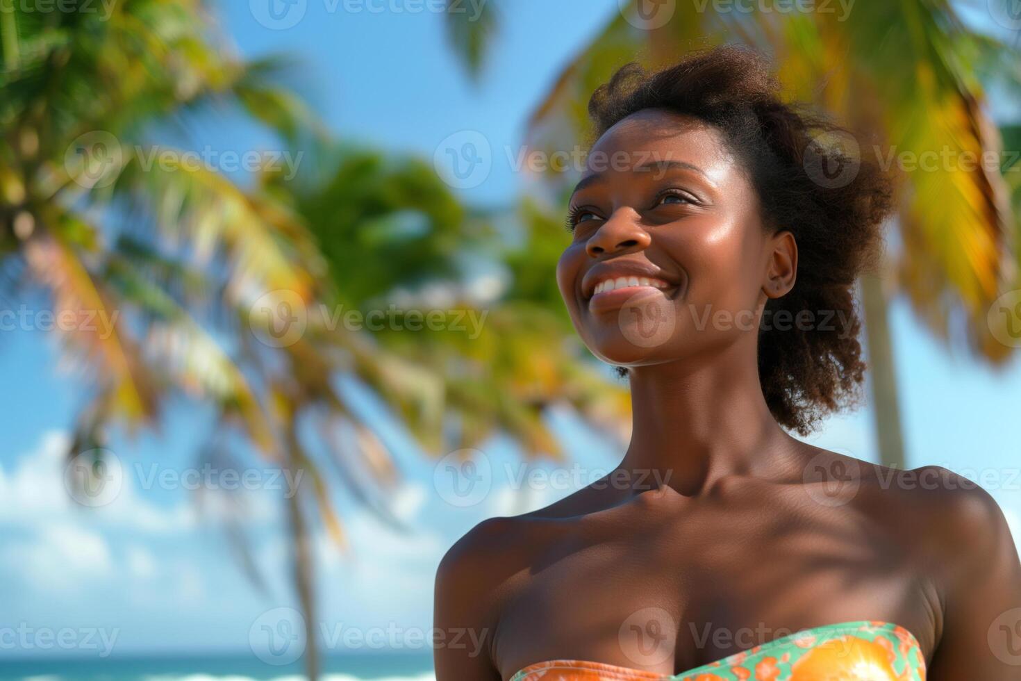 Smiling Black woman enjoying a sunny day at the beach, surrounded by palm trees. photo
