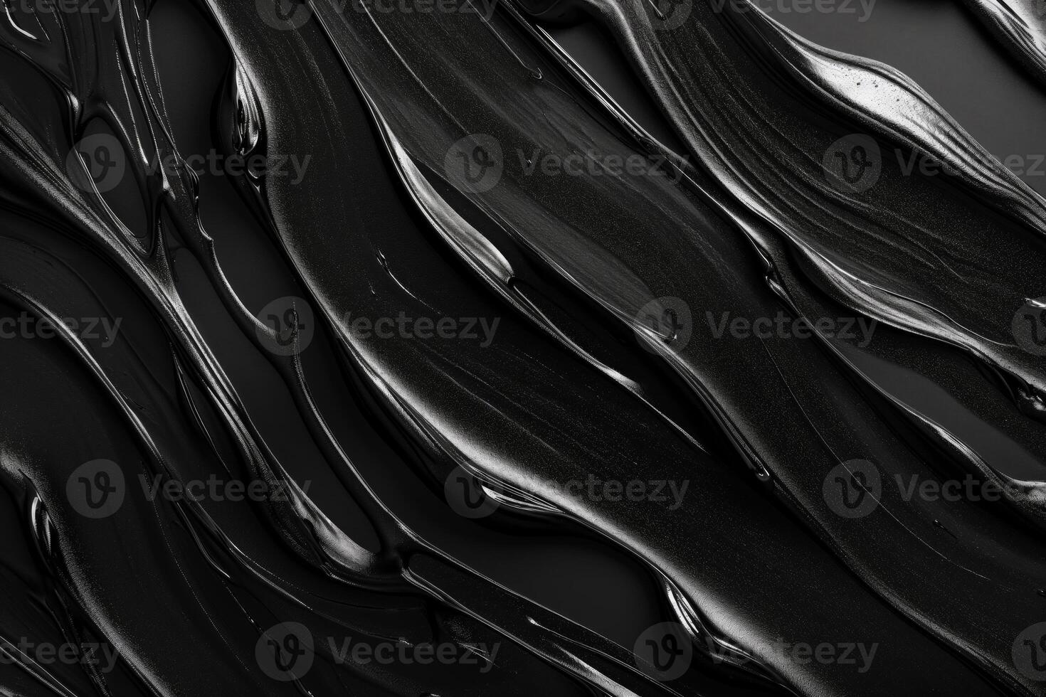 A close-up view of flowing black paint, showcasing a glossy texture and elegant movement. photo
