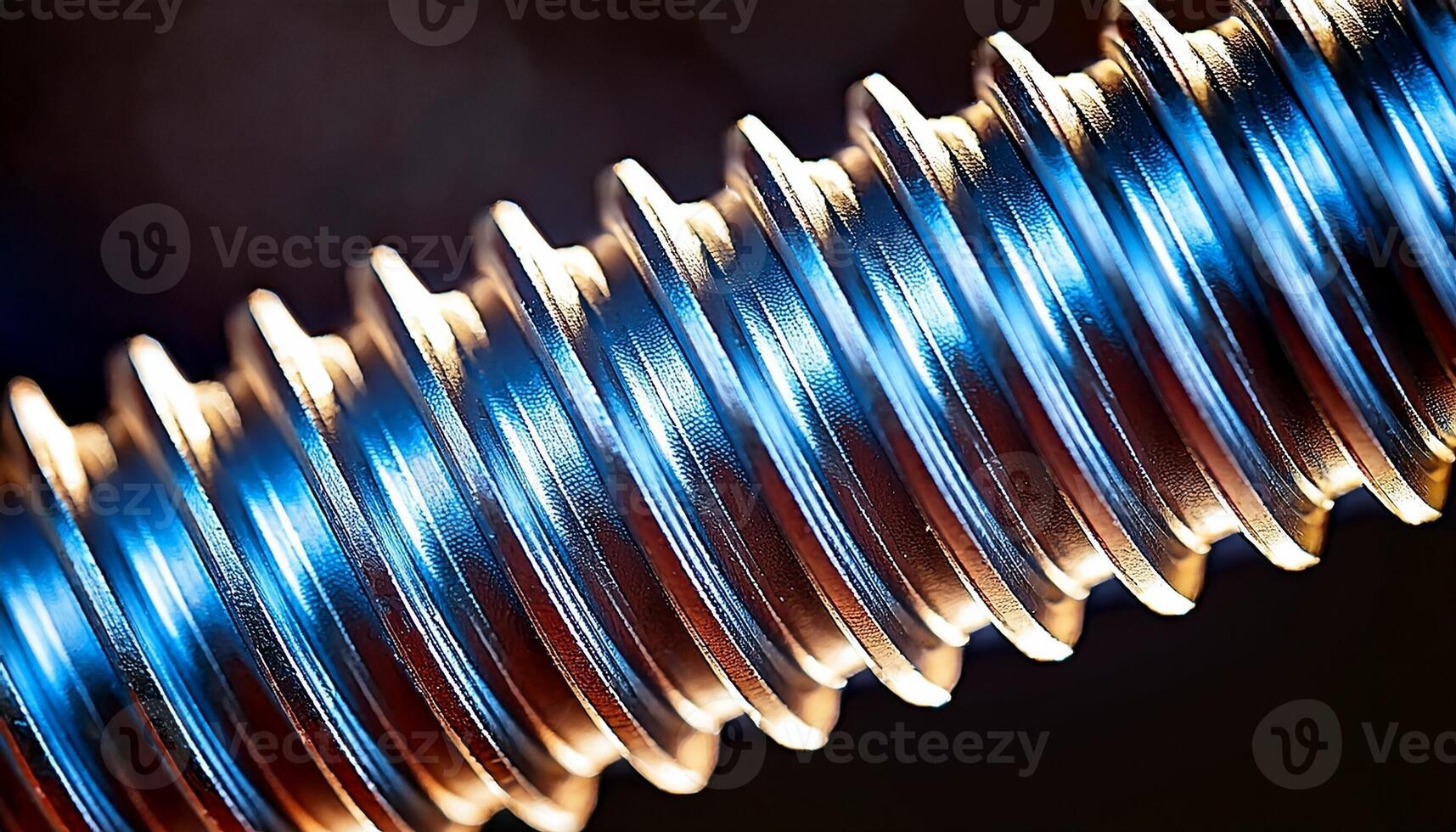 Close-up View of a Shiny Metal Screw Showcasing Intricate Threading and Reflections Under Soft Lighting photo