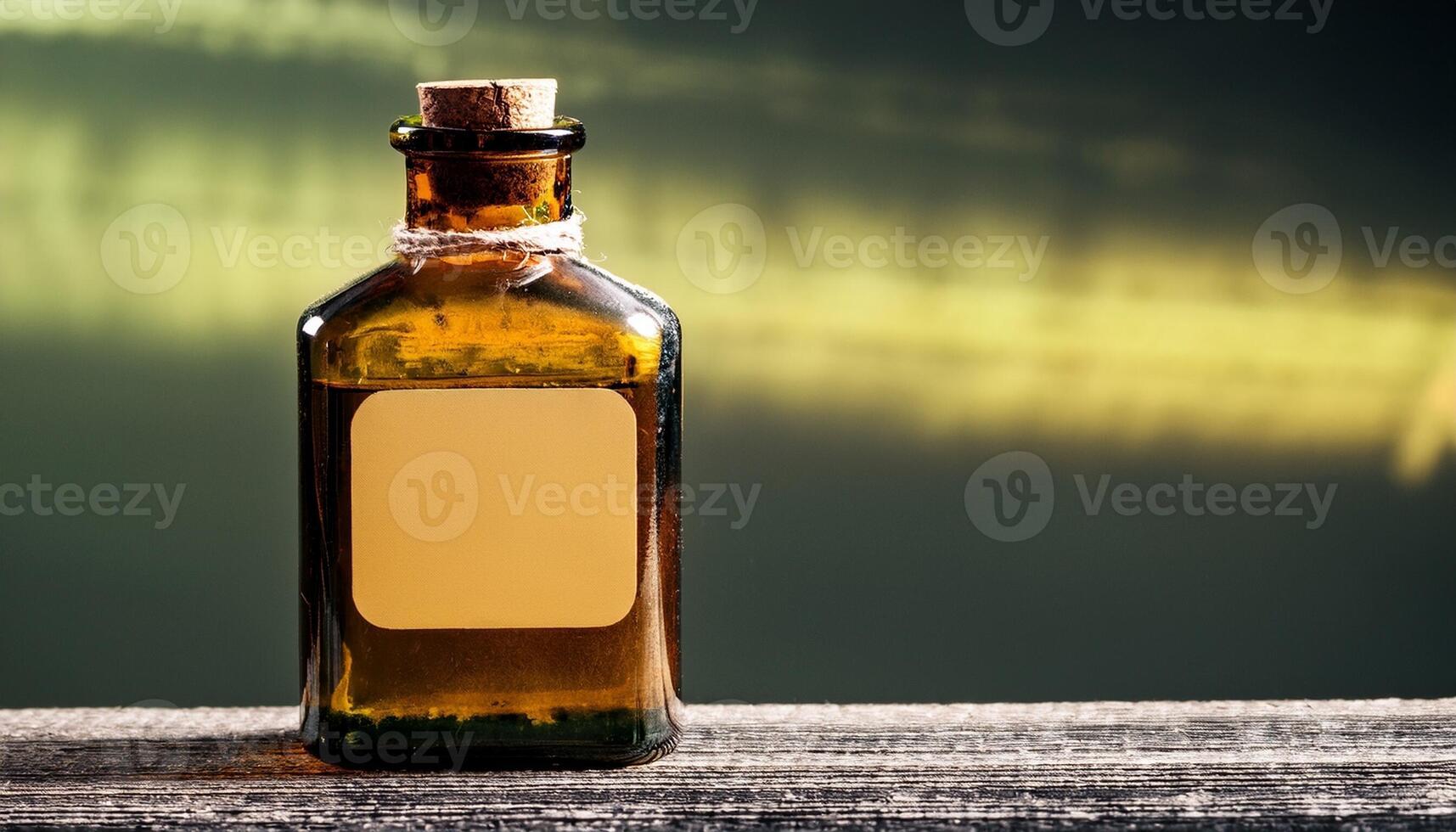 Brown Glass Bottle Filled With Essential Oil Sitting on a Wooden Surface Against a Blurred Background photo