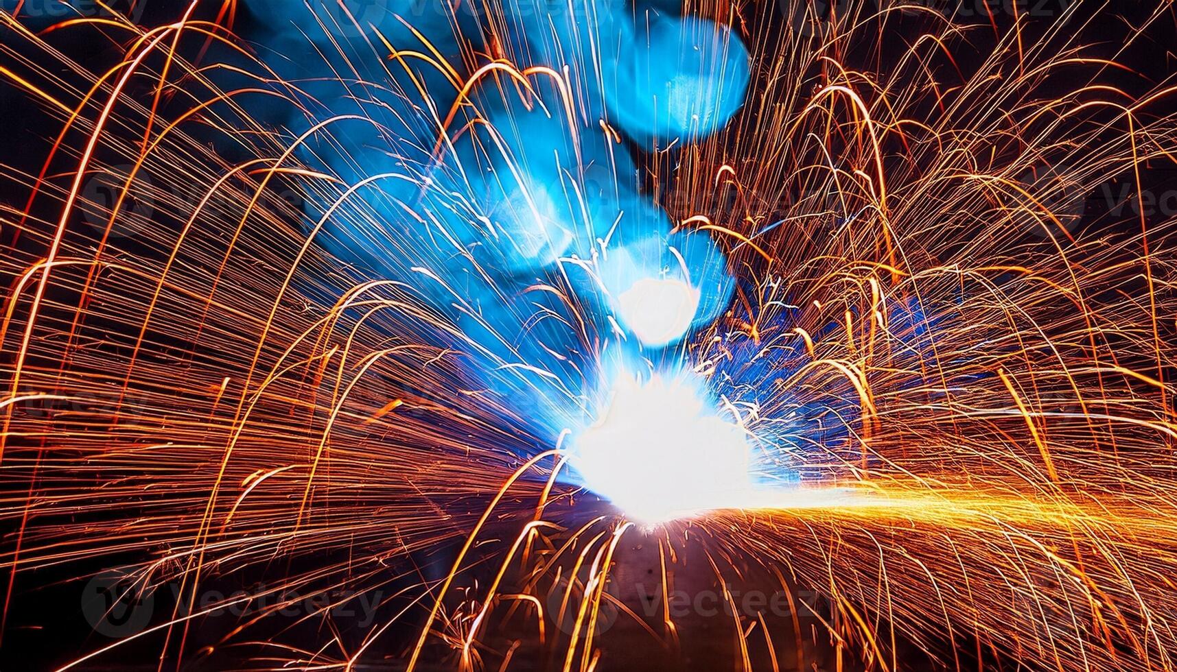 Bright Sparks and Vivid Colors Illuminate a Night Scene During a Lively Celebration With Fireworks and Pyrotechnics photo