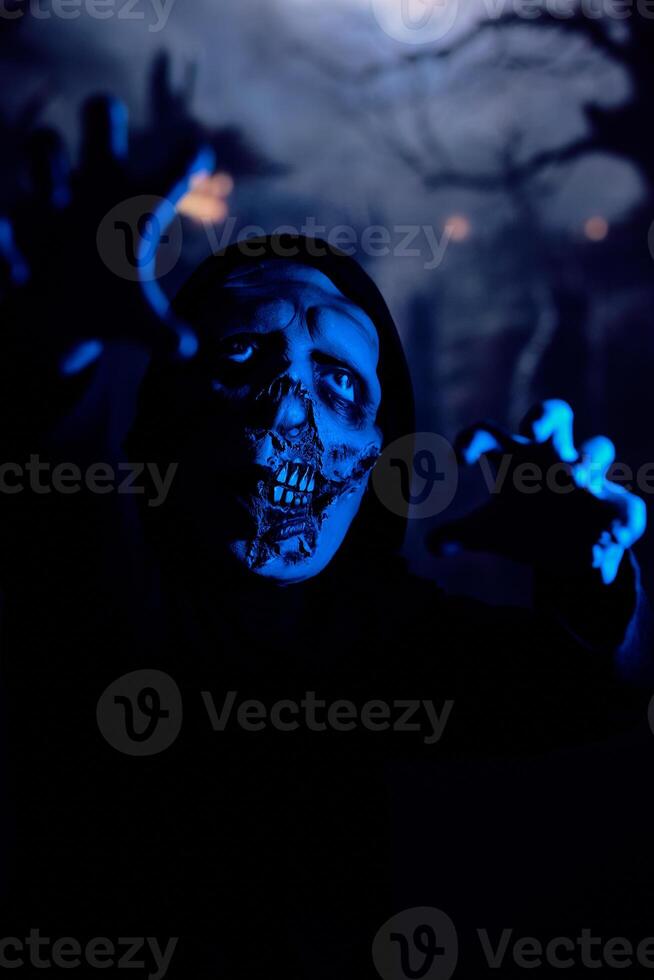 Terrible zombie walking towards camera photo