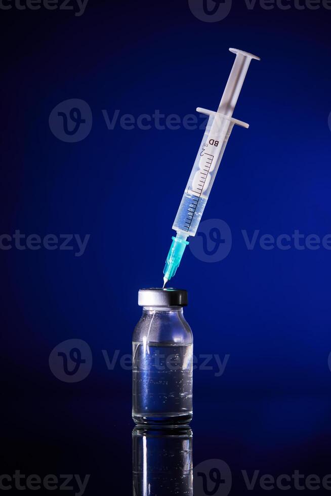 Injection with vaccine for COVID19 in studio photo
