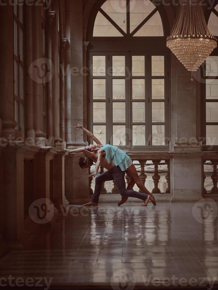 Unrecognizable couple dancing in hall photo
