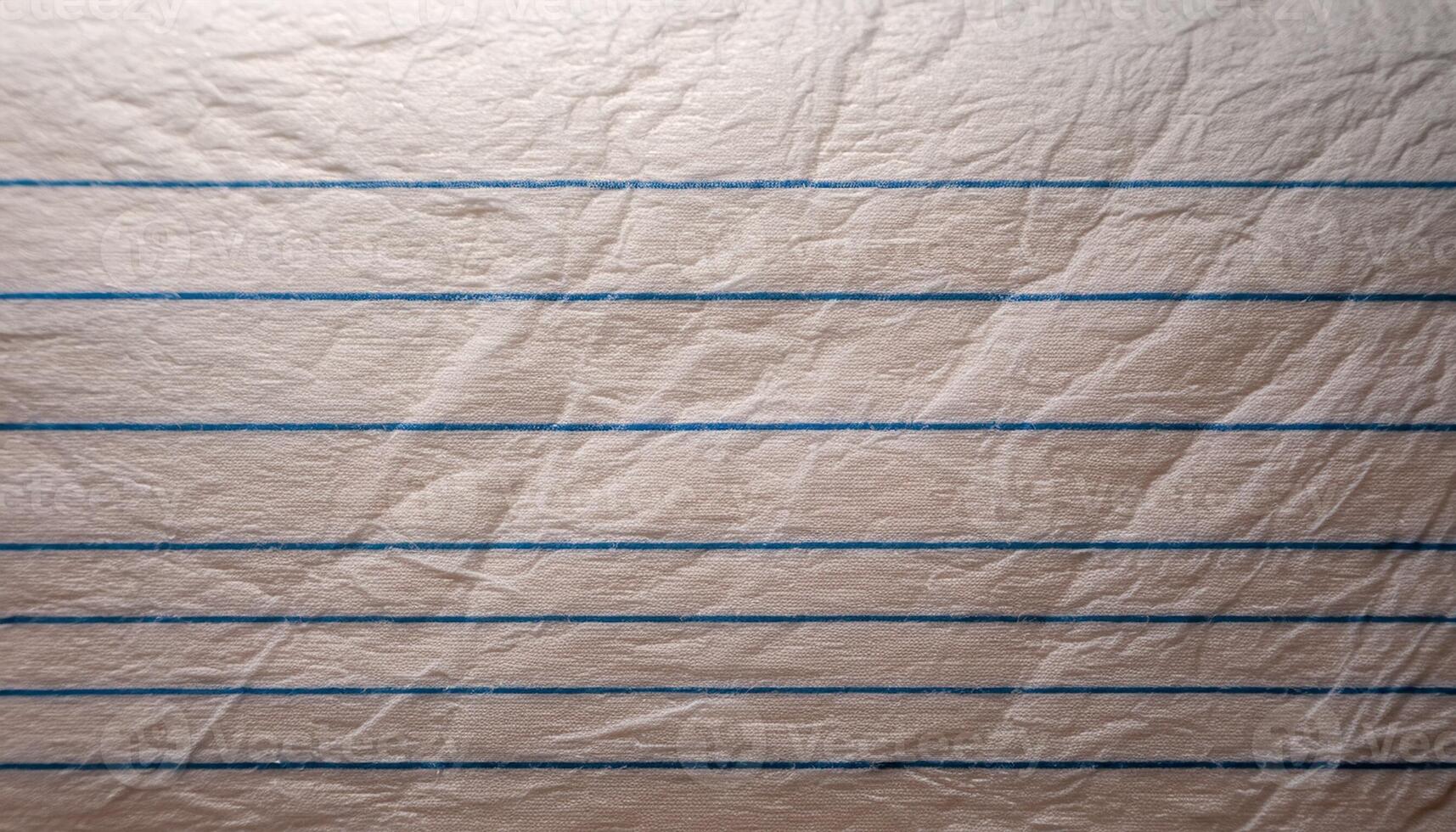 Crumpled Lined Paper on a Wooden Surface With Blue Lines and a Textured Appearance photo