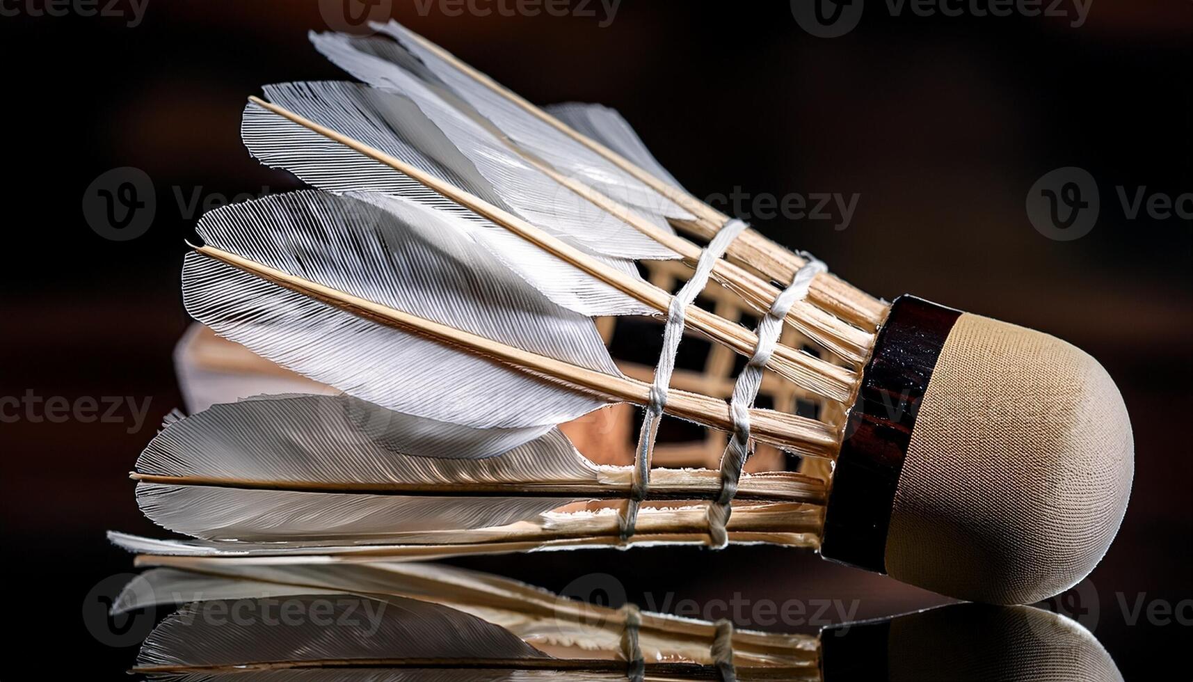 Vintage Shuttlecock Used in a Badminton Game Resting on a Reflective Surface in a Indoor Setting During Late Evening photo