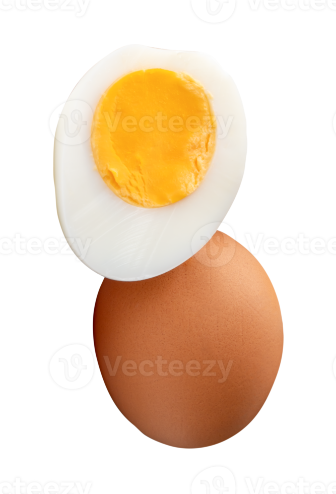 Front view of raw brown chicken eggs and cooked or boiled chicken egg with egg yolk in half in stack isolated with clipping path in file format png