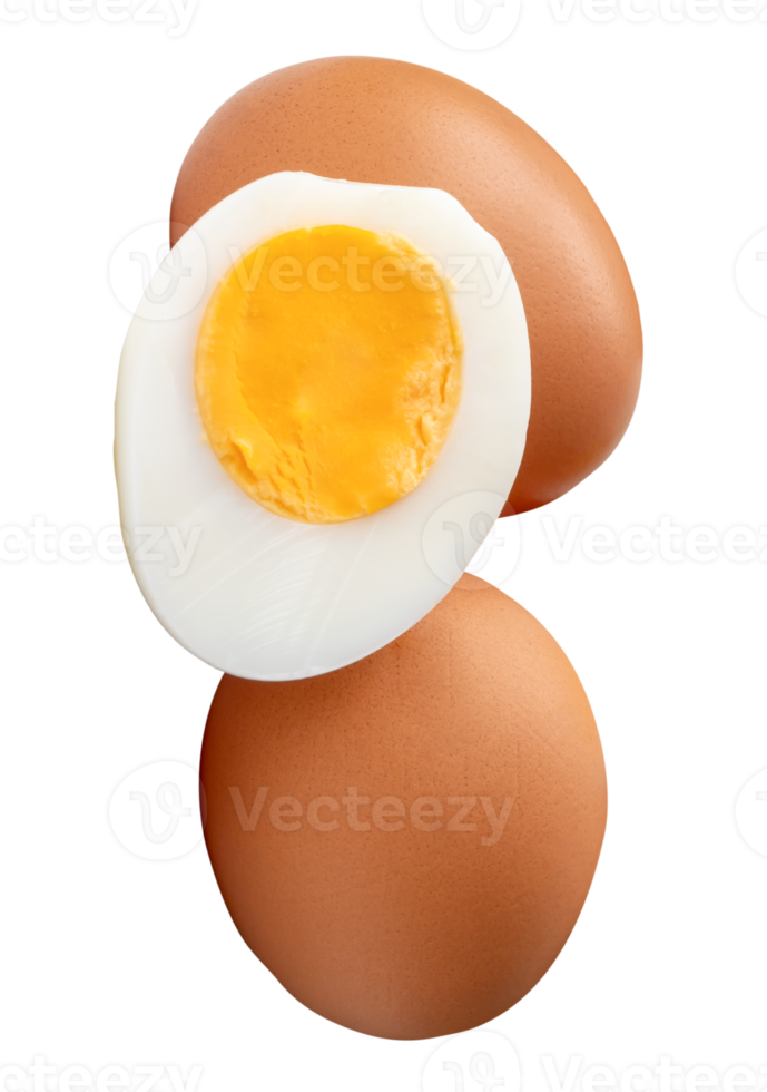 Raw brown chicken eggs and cooked or boiled chicken egg with egg yolk in half in stack isolated with clipping path in file format png