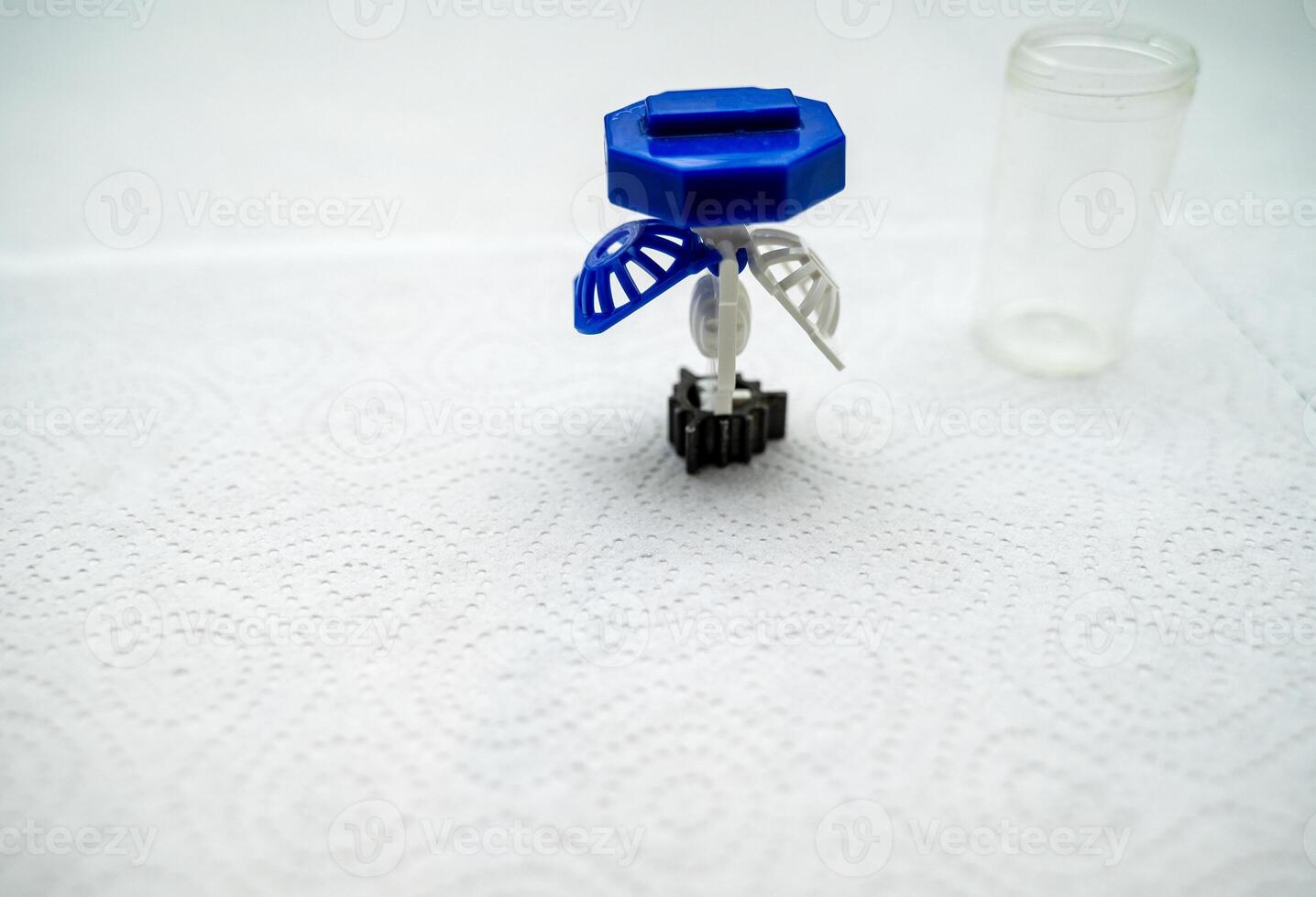container for cleaning and storing contact lenses for eyes, used at home. For soft and hard lenses. the container consists of two parts, the first one for lenses, open, the second part for liquid. photo