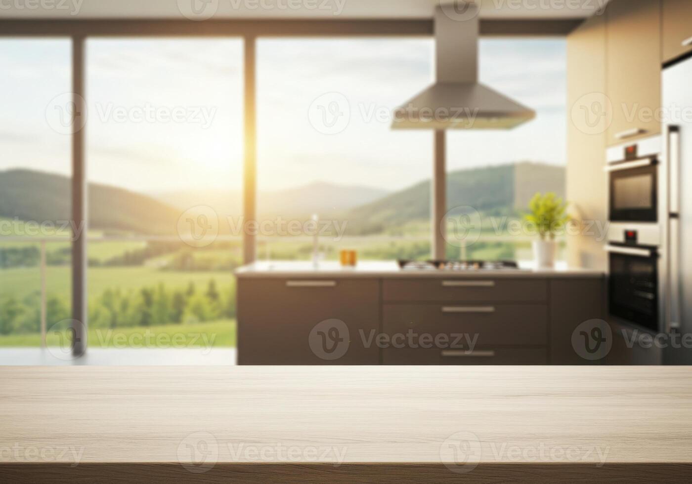 An empty table in front of a kitchen with a view of the mountains photo