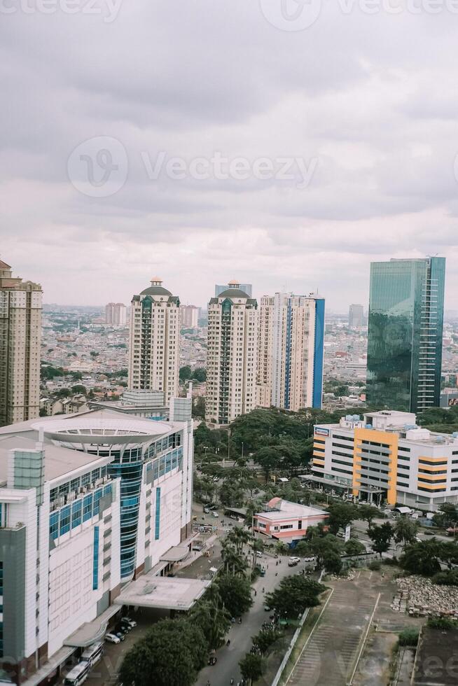 Metropolitan Skyline View with High-Rise Buildings Under Cloudy Sky photo