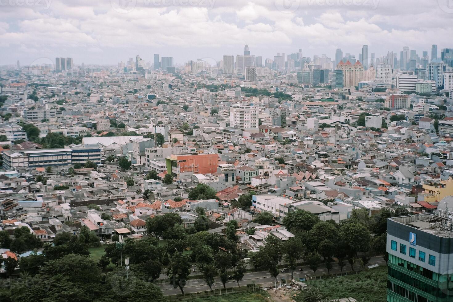 Dense urban sprawl in a vibrant city with modern skyline backdrop photo