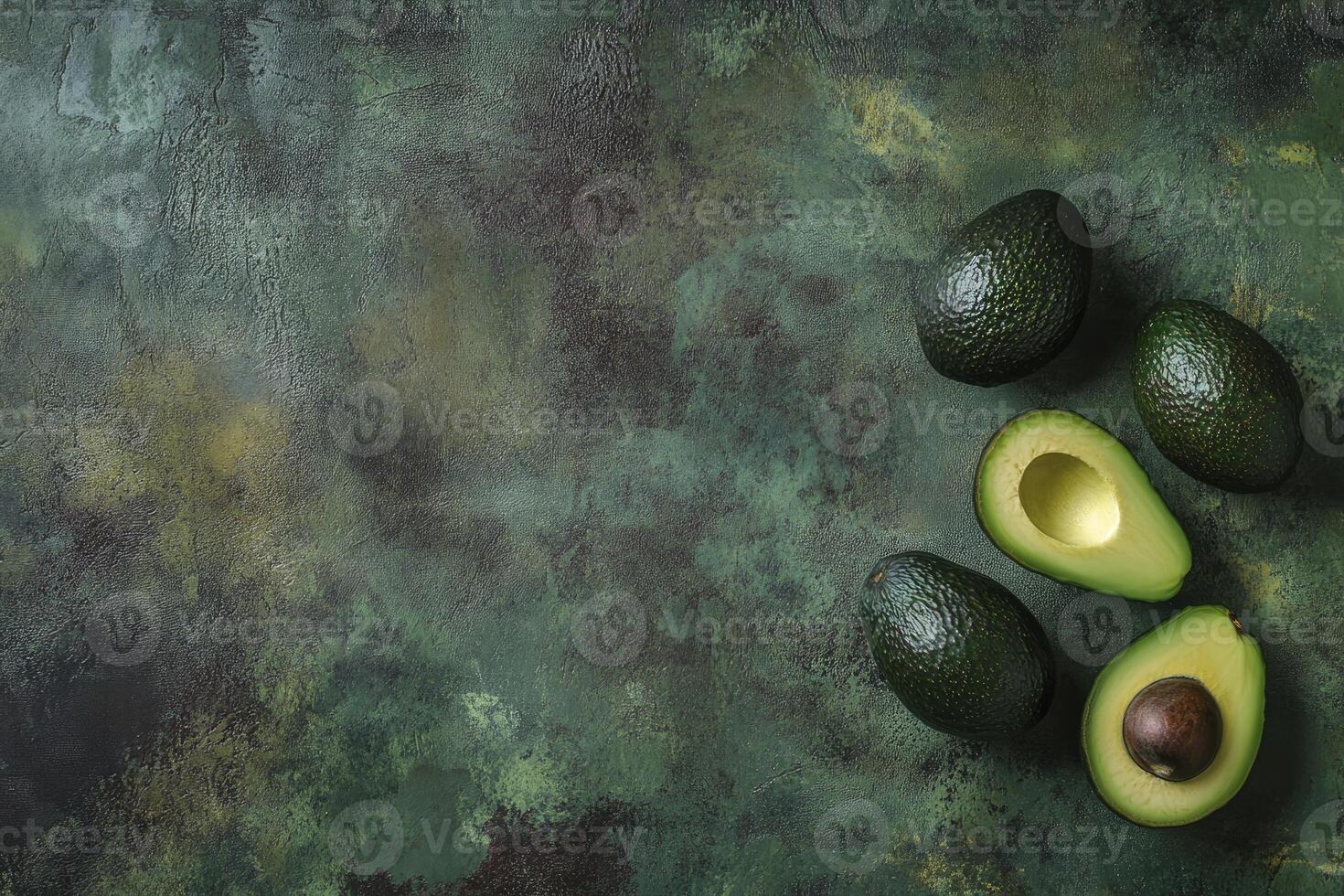 Fresh Avocado Still Life Arrangement on Textured Green Surface Flat Lay photo