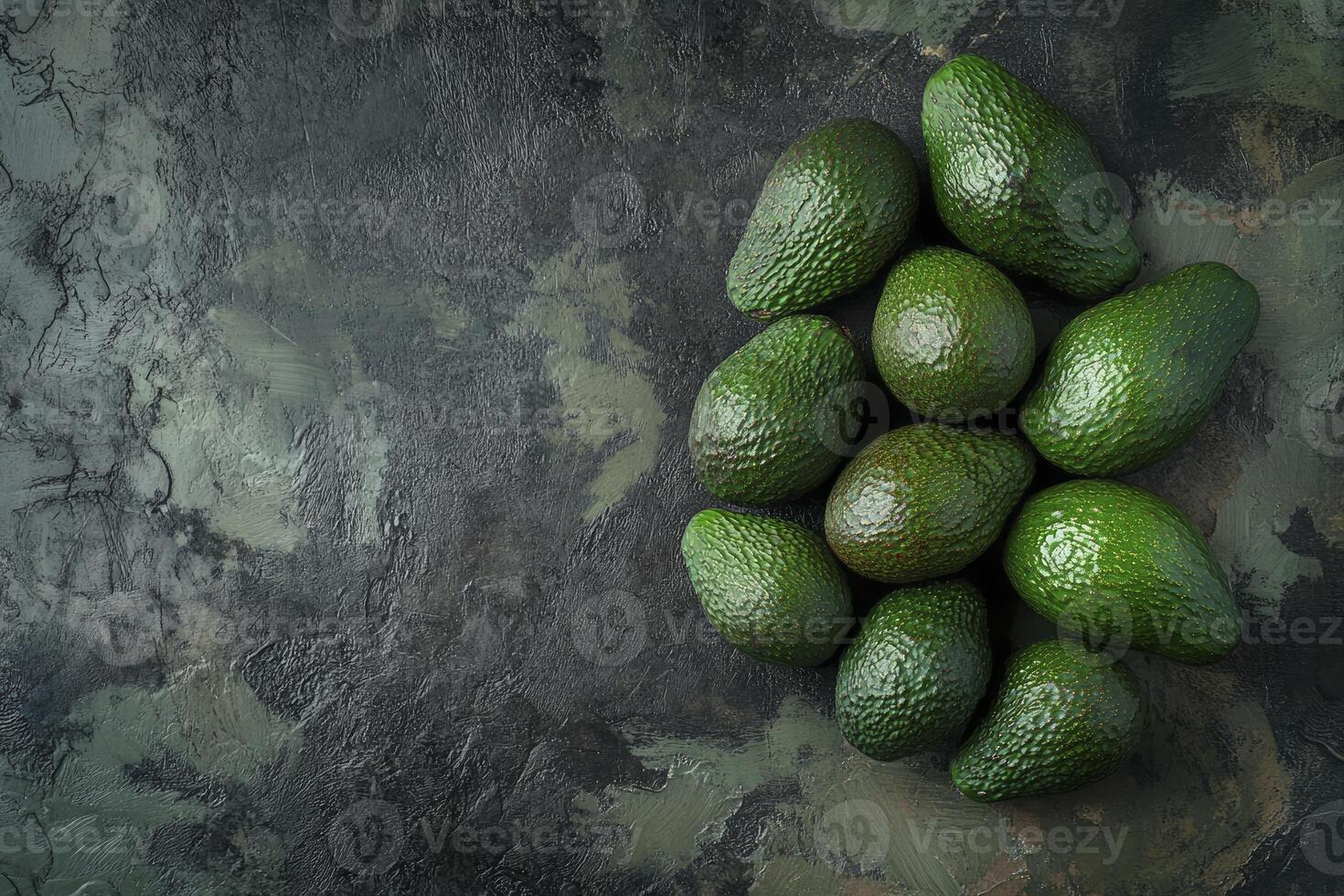 Fresh Green Avocados on Dark Textured Background for Healthy Food Concepts photo