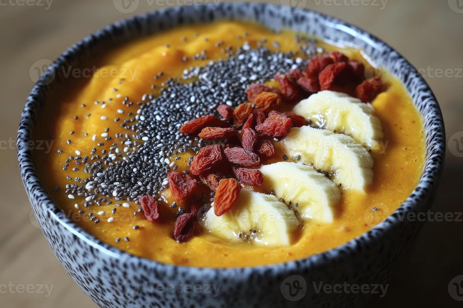 Enjoying Healthy Smoothie Bowl with Banana Goji Berries and Chia Seeds photo
