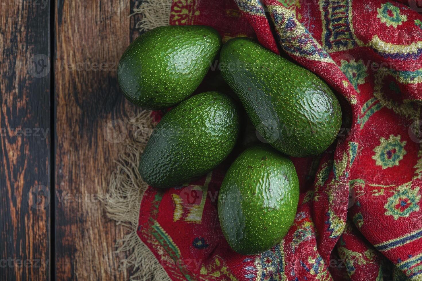 Avocados on Colorful Cloth and Wood Table Still Life Composition photo