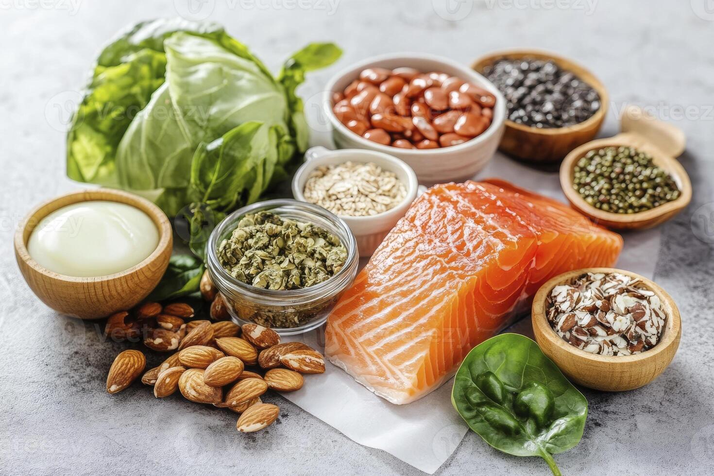 Arrangement of Nutritious Foods Including Salmon, Vegetables, Legumes and Almonds photo