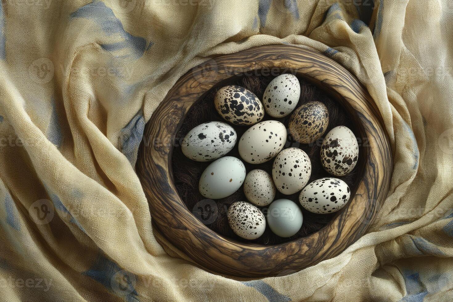 Quail Eggs Nest in Wooden Bowl with Neutral Colored Fabric Drape photo