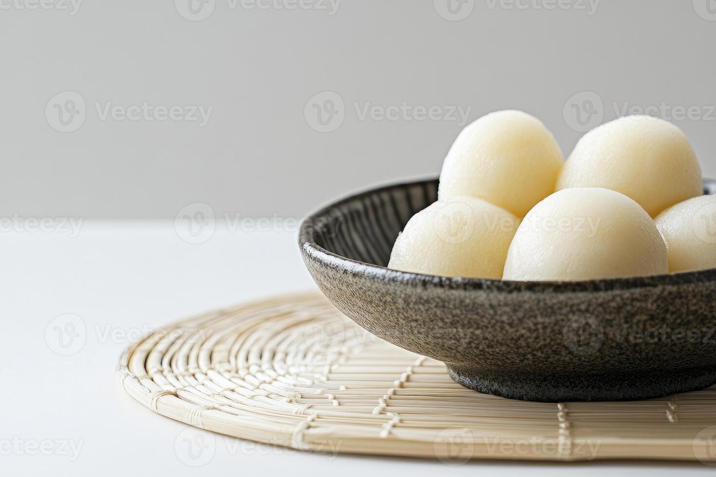 Japanese Mochi Rice Cake Balls Served in a Bowl on Table photo