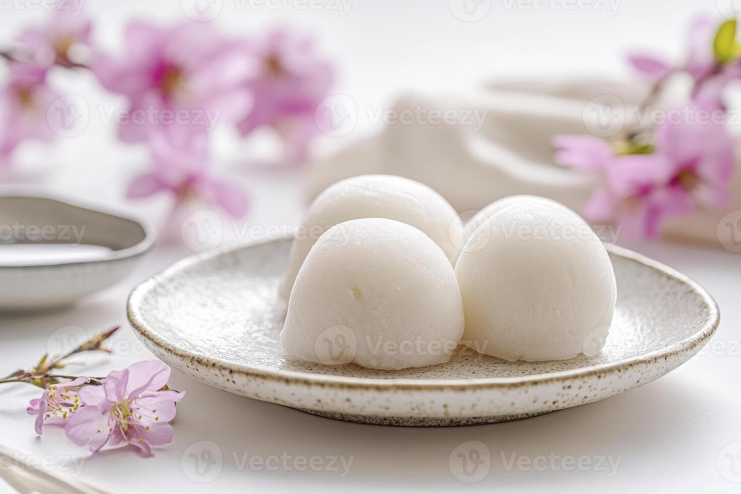 Serving Daifuku Mochi on Plate with Pink Flowers for Dessert photo