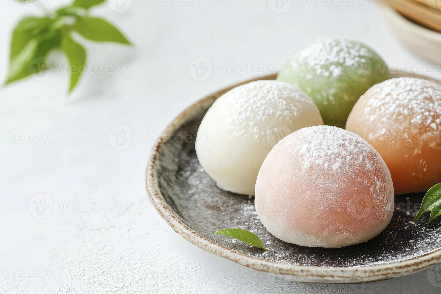 Colorful Mochi on Plate Sprinkled with Powdered Sugar Ready to Eat photo