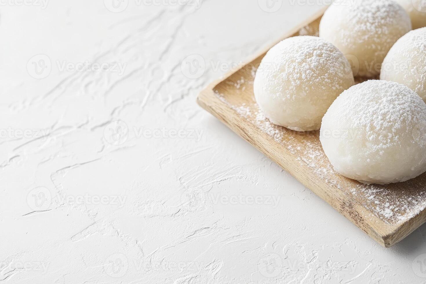 Mochi Rice Cake on Wood Tray with Powdered Sugar Dessert photo