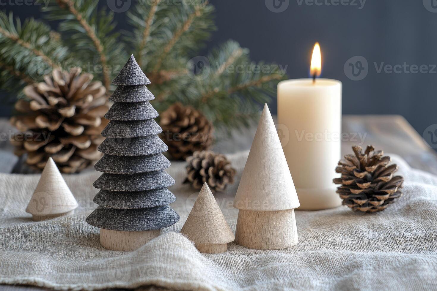 Christmas Tree Decoration with Candle and Pine Cones on Table photo