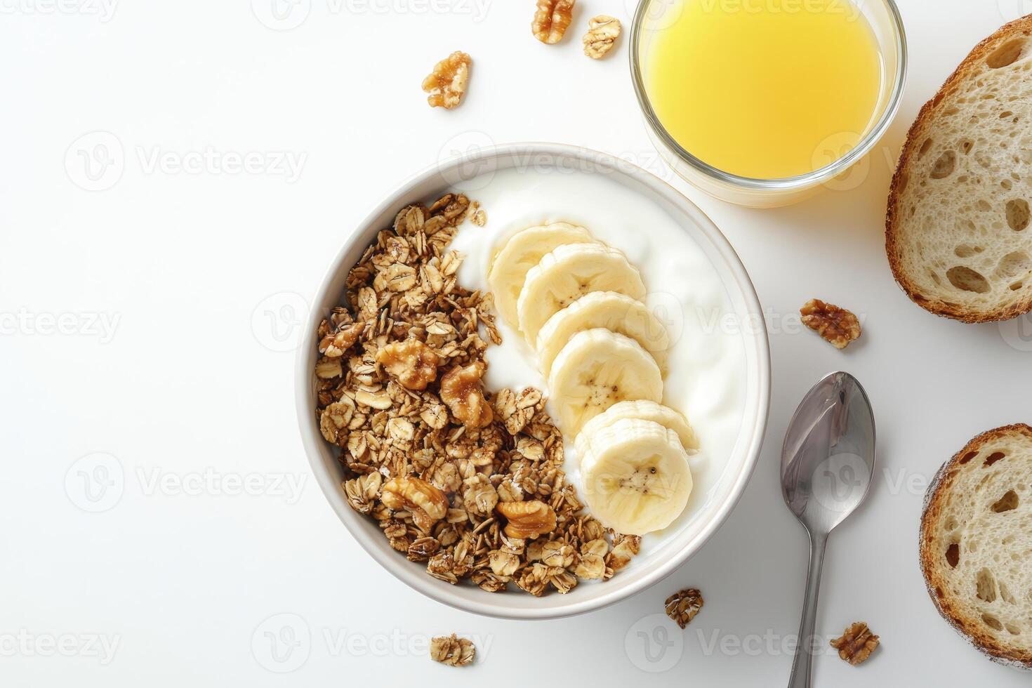 Eating Healthy Breakfast with Granola Yogurt Banana Nuts and Orange Juice photo