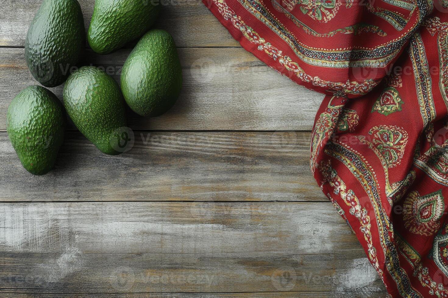 Avocado Fruits Arrangement with Red Textile on Rustic Wooden Table photo
