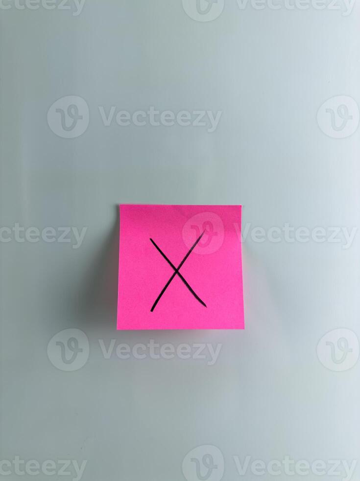 Post it note with cross meaning lie and wrong decision photo
