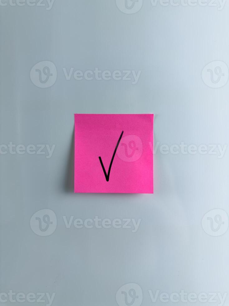 Vertical photo of check mark on sticky note to indicate your choice