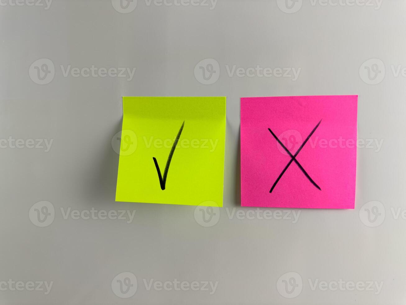 Tick on green background and Cross on red background photo