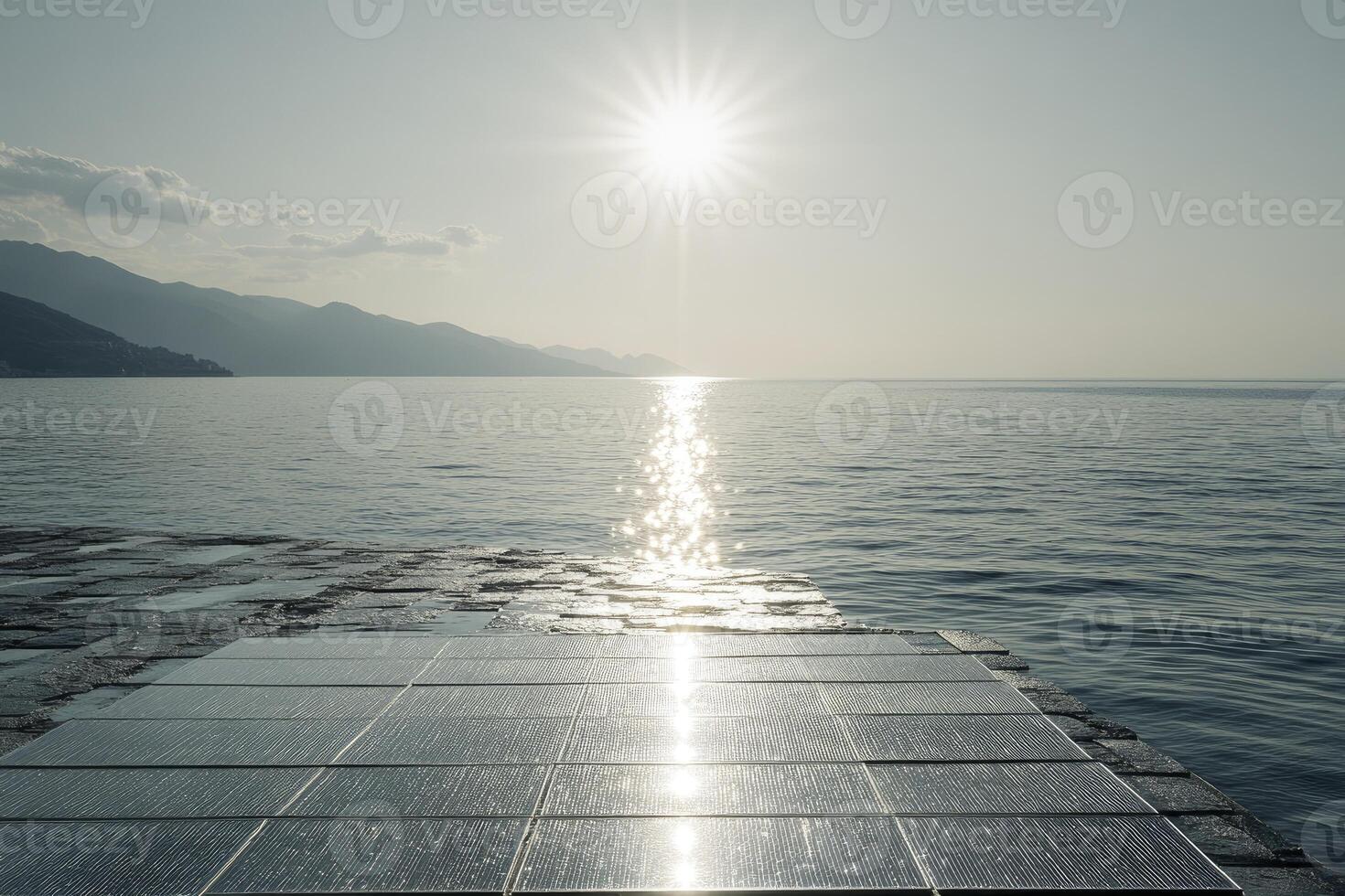 Solar Panel Array Above Water Reflecting Sunlight with Mountain Backdrop photo