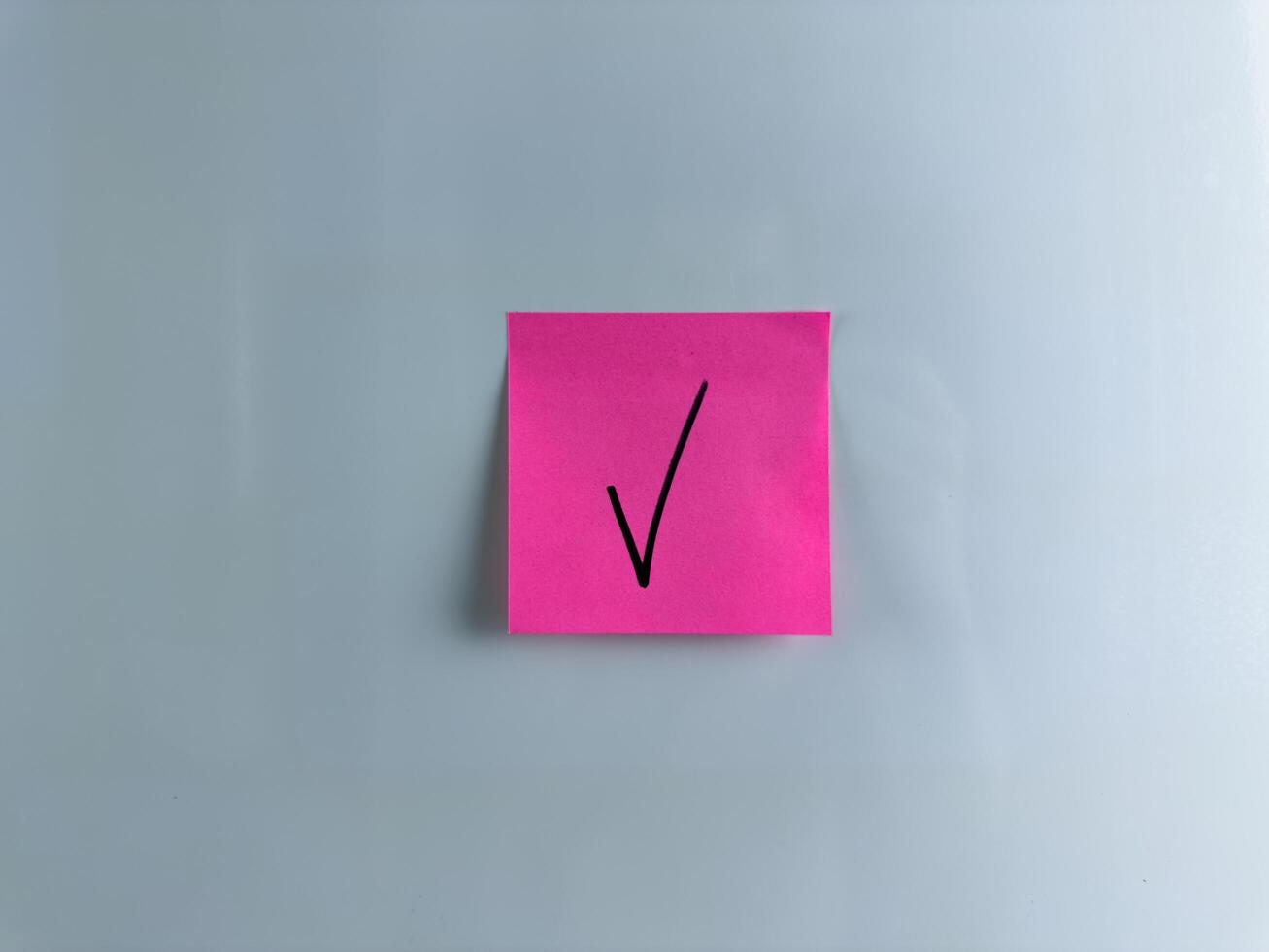 Indicating an answer with check mark photo