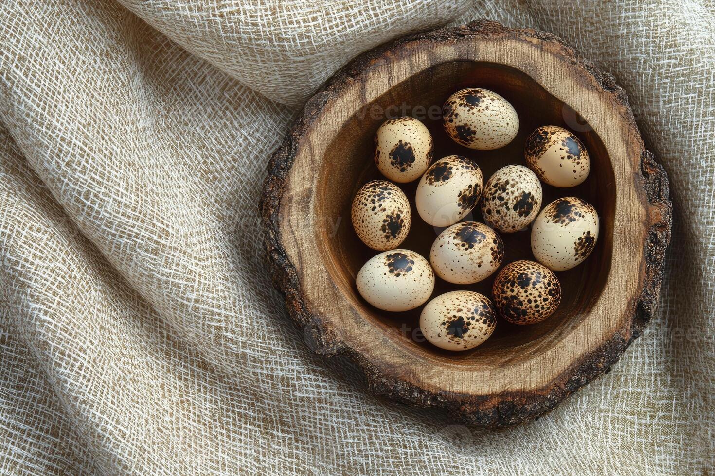 Quail Eggs in Wooden Bowl on Linen Fabric Rustic Composition photo