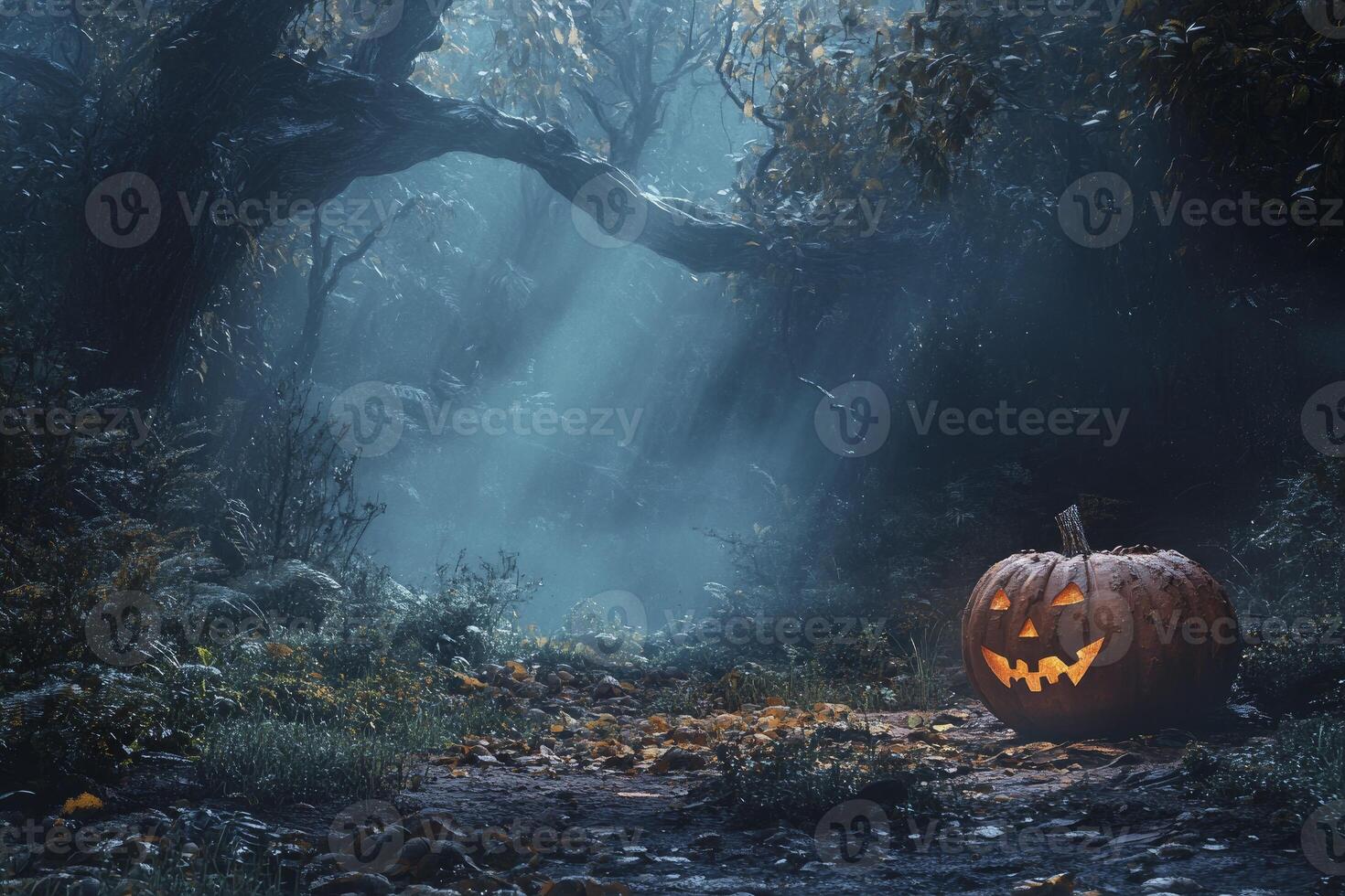 Glowing Jack O Lantern on Forest Path in a Misty Halloween Scene photo