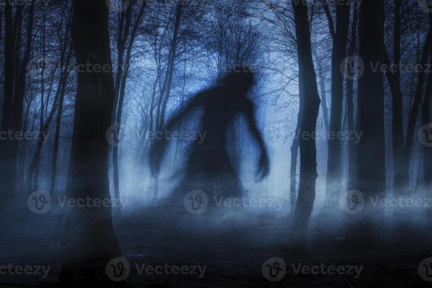 Eerie Figure Emerging From Foggy Forest in Dark and Mysterious Scene photo