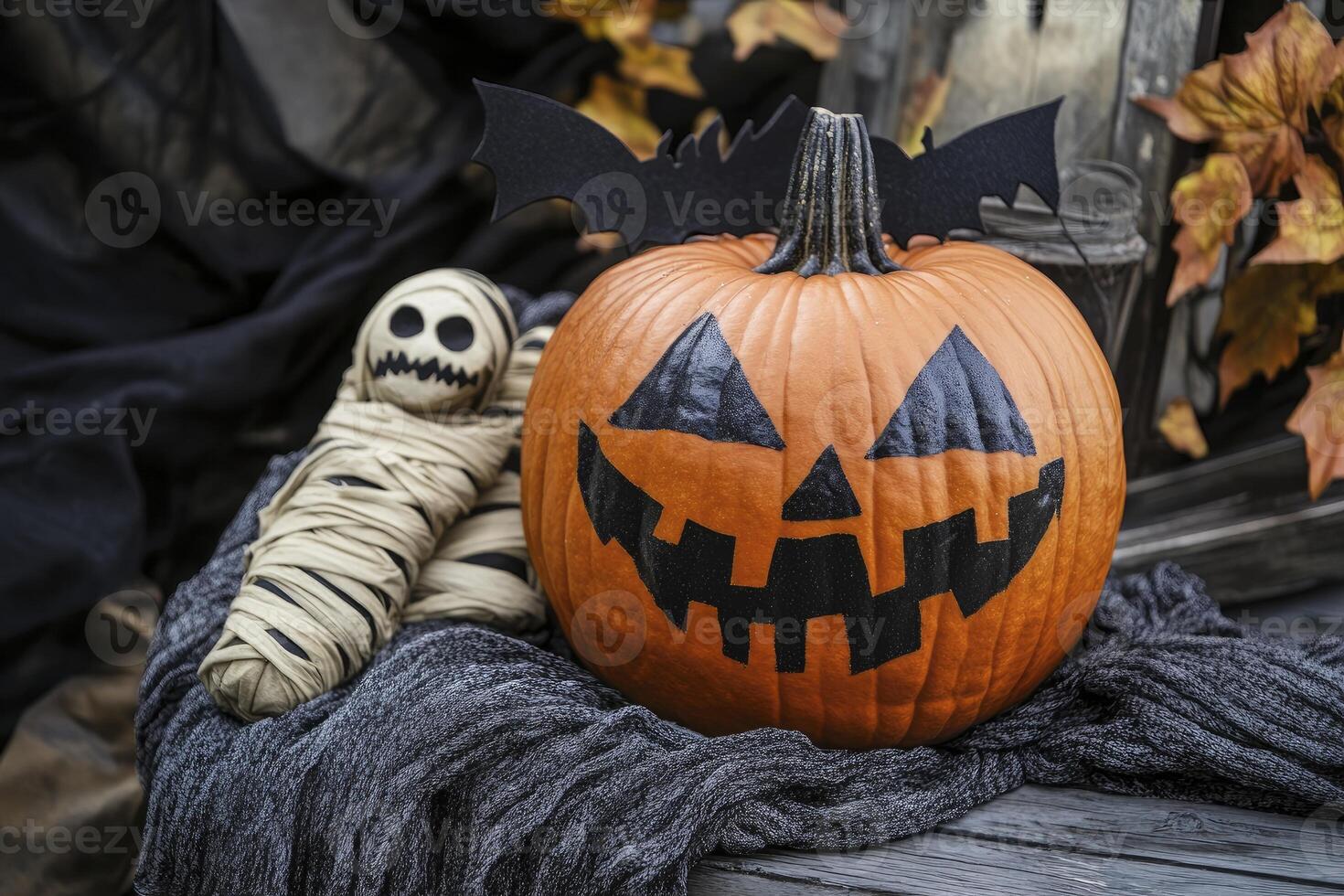 Halloween Pumpkin with Mummy and Bat Decoration on Wood Background photo