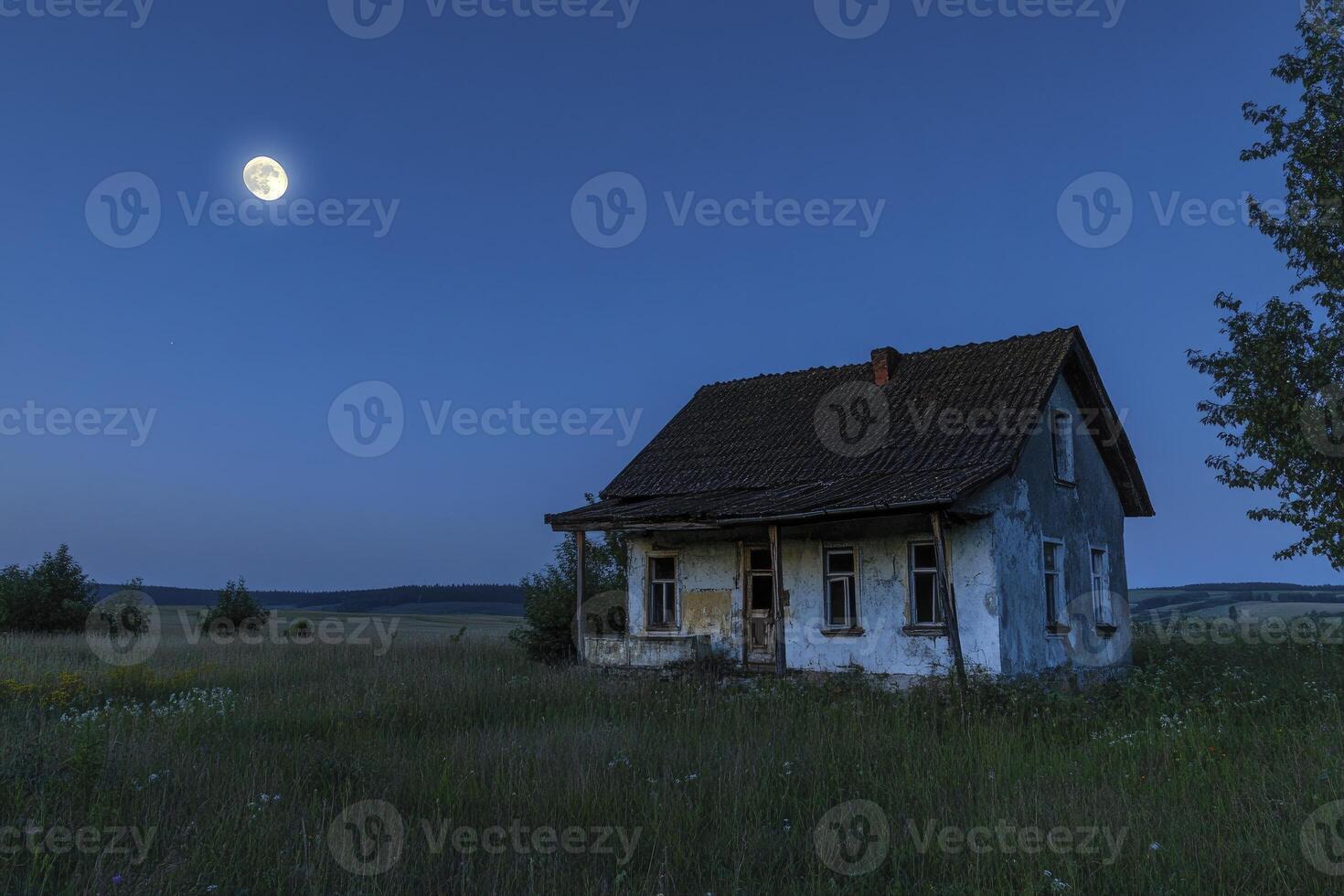 Old House Under Moonlight in Grassy Field at Night Landscape photo