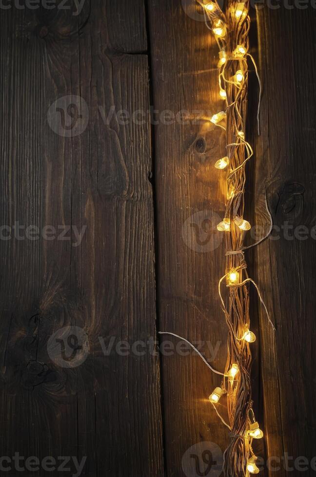String Lights Decorating Dark Wood Surface Creating a Warm Atmosphere photo