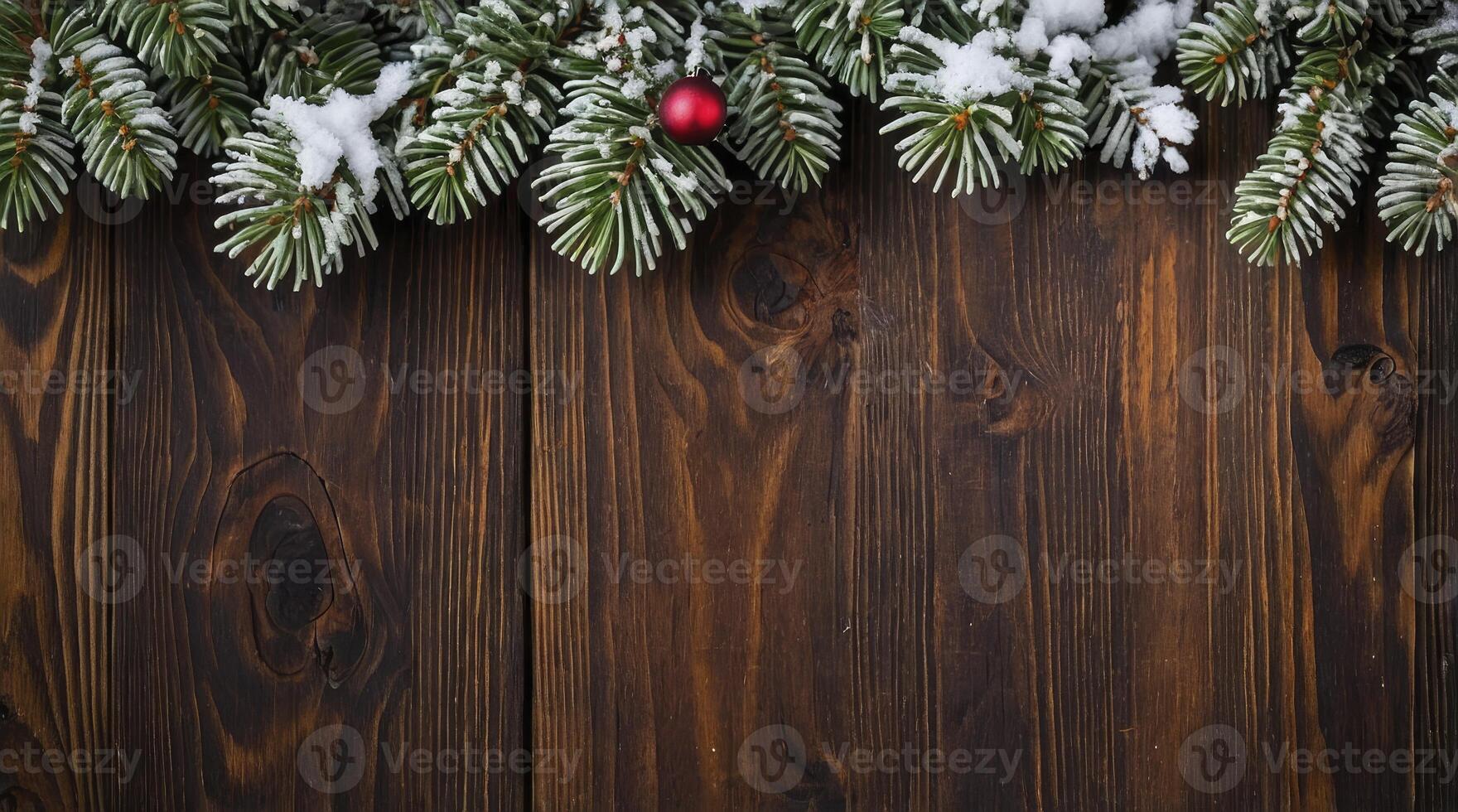 Christmas Tree Branches with Snow and Ornament on Wooden Table photo