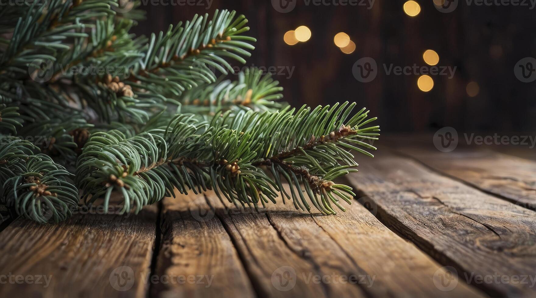 Fir Branch on Rustic Wood Surface with Blurred Lights Background photo